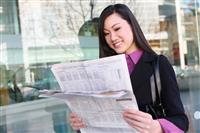 Asian Business Woman Reading Newspaper stock photo