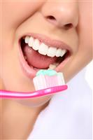 Woman Brushing Teeth stock photo