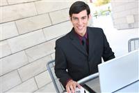 Handsome Business Man with Laptop stock photo