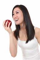 Asian Woman Eating Apple stock photo