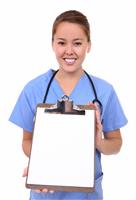 Pretty Nurse Holding Clipboard stock photo