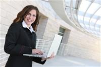 Business Woman Holding Laptop stock photo