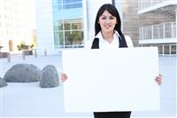 Pretty Business Woman Holding Sign stock photo