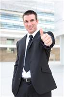 Business Man Signaling Success stock photo
