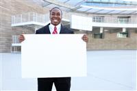 African Business Man Holding Sign stock photo