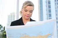 Business Woman Reading Map stock photo