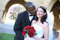 Attractive Interracial Wedding Couple Kissing stock photo