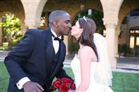 Man and Woman Interracial Wedding Couple Kiss stock photo