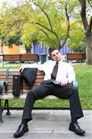 Bored Business Man on Bench stock photo