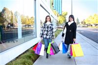 Pretty Women Shopping with Colorful Bags stock photo