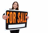 Asian Woman Holding Sale Sign stock photo