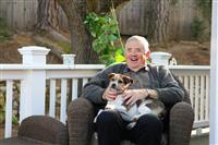 Happy Elderly Man with Dog stock photo