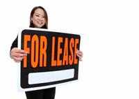 Asian Woman Holding Lease Sign stock photo