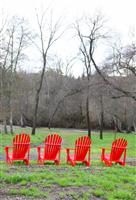 Four Red Chairs in Countryside stock photo